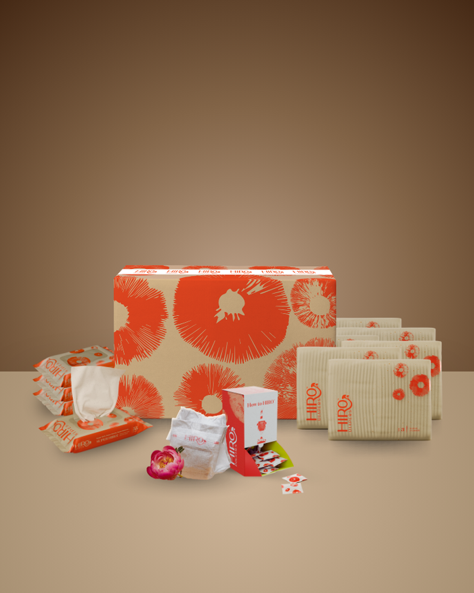 Collection of HIBO products including boxes, packets, and a box cutter on a beige background